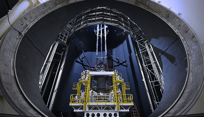 Outside the enormous mouth of NASA’s giant thermal vacuum chamber at Johnson Space Center in Houston, engineers and technicians prepare to test the James Webb Space Telescope. Minus K Technology supplied six negative-stiffness vibration isolators to keep the telescope and test equipment isolated from vibrations during the months of testing.