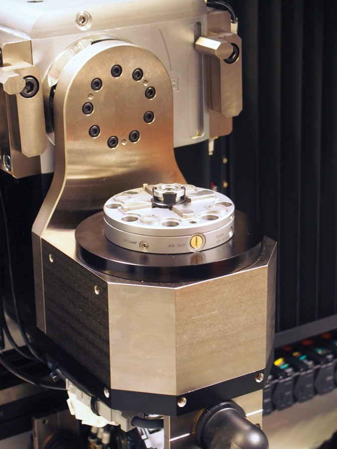 Yaskawa’s direct-drive servomotor, 2 in. high and 5.3 in. in diameter, delivers 4 Nm of torque in the small footprint necessary for Microlution’s micro machining application.